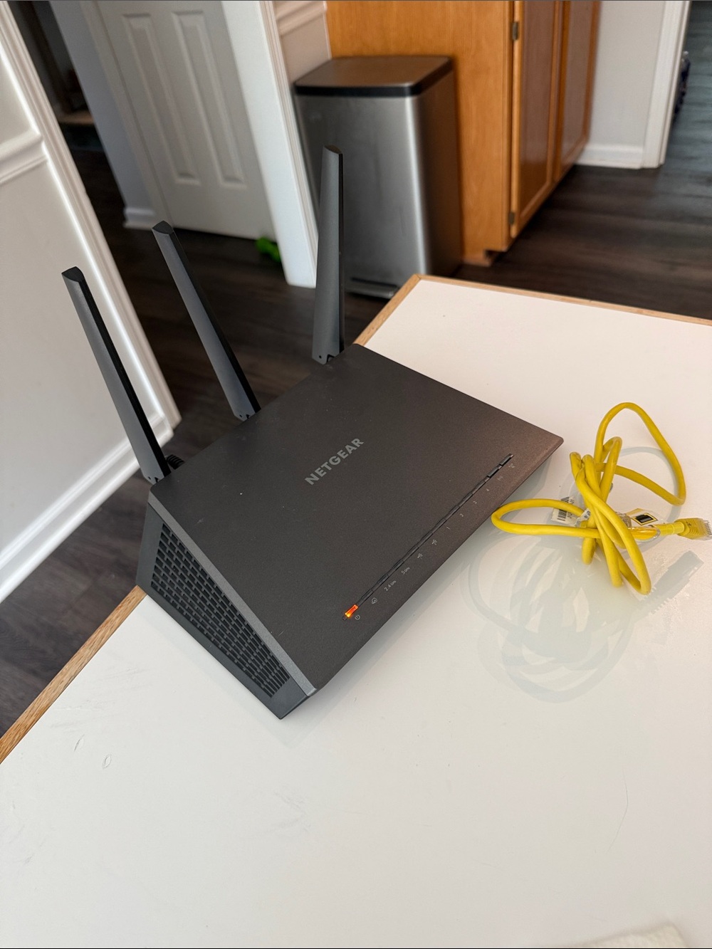 NETGEAR Black Wireless Router with Yellow Ethernet Cable